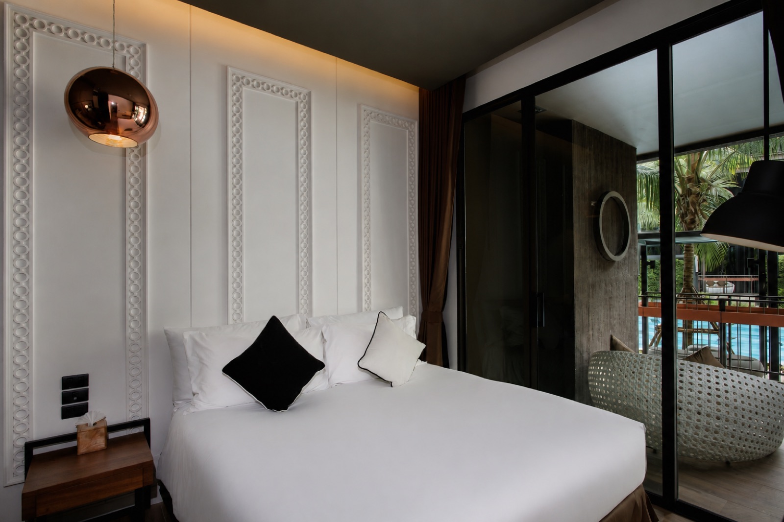 Room interior with freestanding tub and balcony