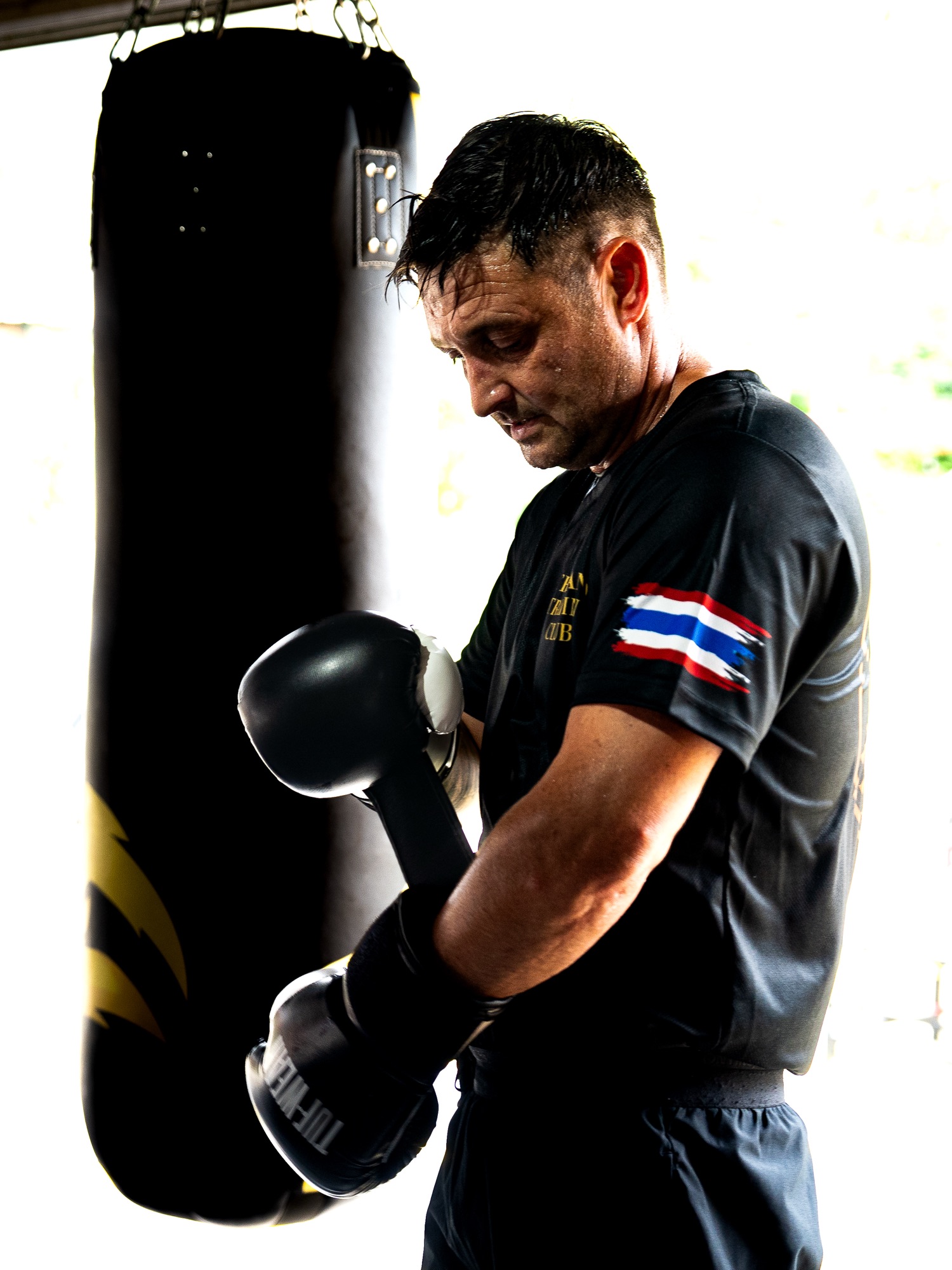 Camp member working the heavy bag